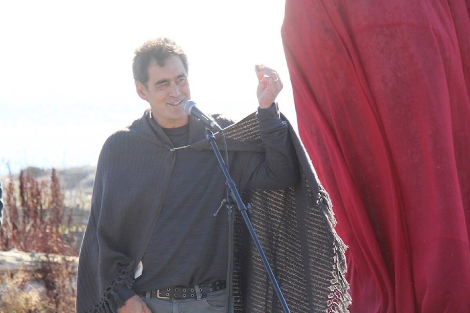 Saanich artist Kent Laforme explains how each stone has a story to tell, during the official unveiling of his work at Cattle Point in Oak Bay on Oct. 5. (Christine van Reeuwyk/News Staff) 