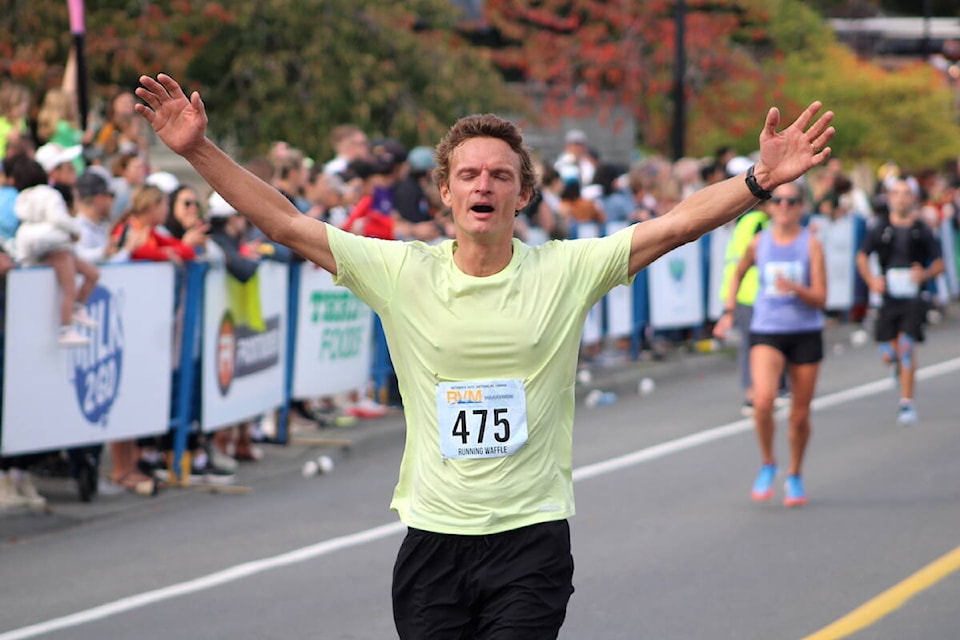 Runners cross the Royal Victoria Marathon’s finish line on Belleville Street on Oct. 8. (Jake Romphf/News Staff) 