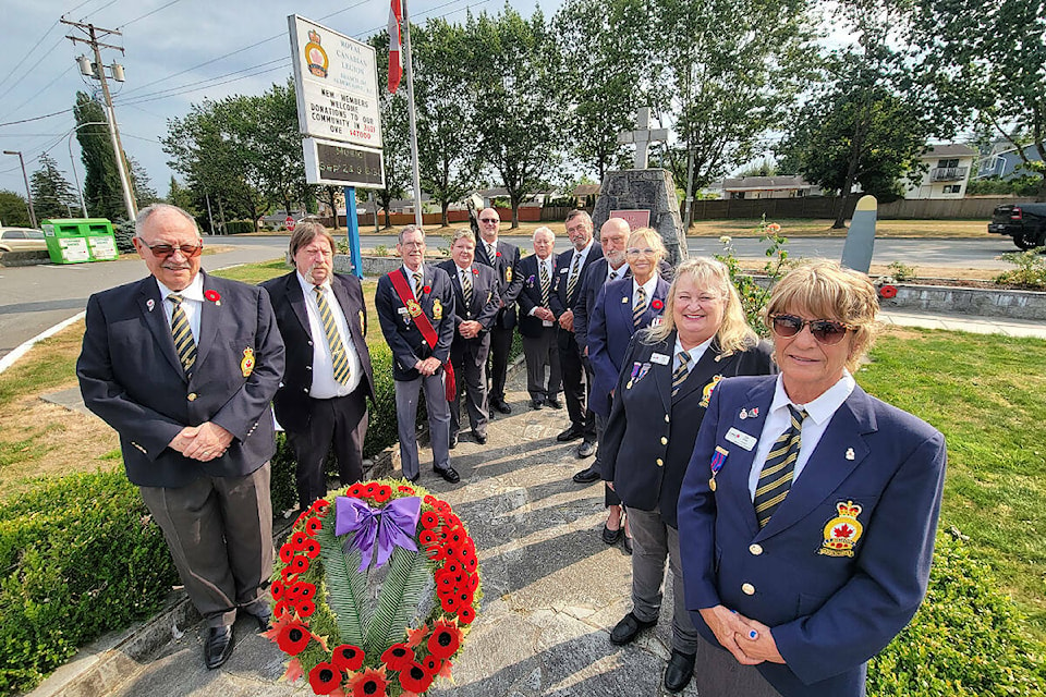 Members of the Royal Canadian Legion Aldergrove branch posed in front of the cenotaph outside the branch at 26607 Fraser Highway as part of a national day of mourning for Queen Elizabeth. (Langley Advance Times files) 