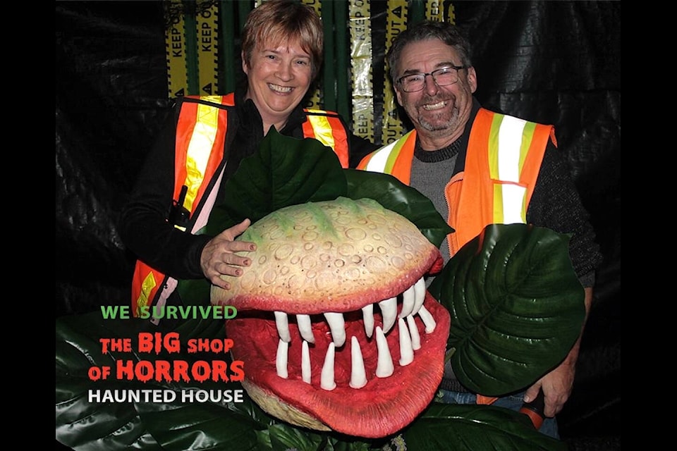 Daphne and Rick Swift have been hosting their Big Shop of Horrors at the Cowichan Exhibition Grounds since 2019. Before that they ran in out of their home. The Swifts pose with their mascot Seymour, the venus fly trap affectionately remembered from ‘The Little Shop of Horrors’ play and film. (Courtesy of Daphne Swift) 