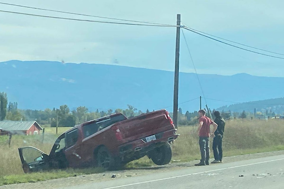 A pickup truck is seen in the ditch along Highway 97A north of Enderby on Oct. 9, 2023. (Sydney Watt photo) 
