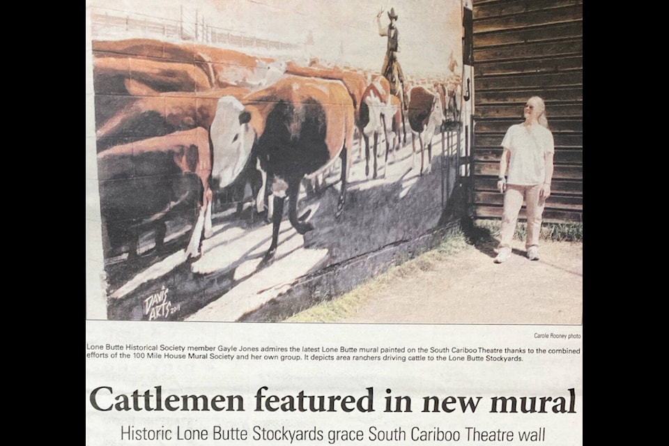 Lone Butte Historical Association member Gayle Jones stands in front of the last of four murals depicting the history of Lone Butte to be painted on four outside walls of the South Cariboo Theatre back in August 2014. (From the Free Press Archives) 
