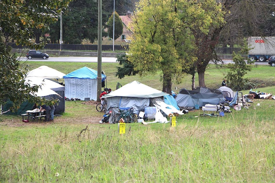 Occupants of an encampment on the south side of Highway 1 at Clearbrook Road in Abbotsford have been given until Wednesday, Oct. 18 to leave the site. (Vikki Hopes/Abbotsford News) 
