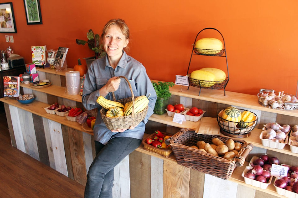 Elisabeth Bond with some samples of the abundant fresh produce now available on a regular basis at the Jollity Farm Shop & Cafe on Oak Street in Chemainus. (Photo by Don Bodger) 
