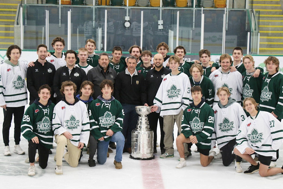 Bruno Campese poses with the Stanley Cup alongside the Nelson Leafs at the Nelson and District Community Complex on Sunday. Photo: Bob Hall 