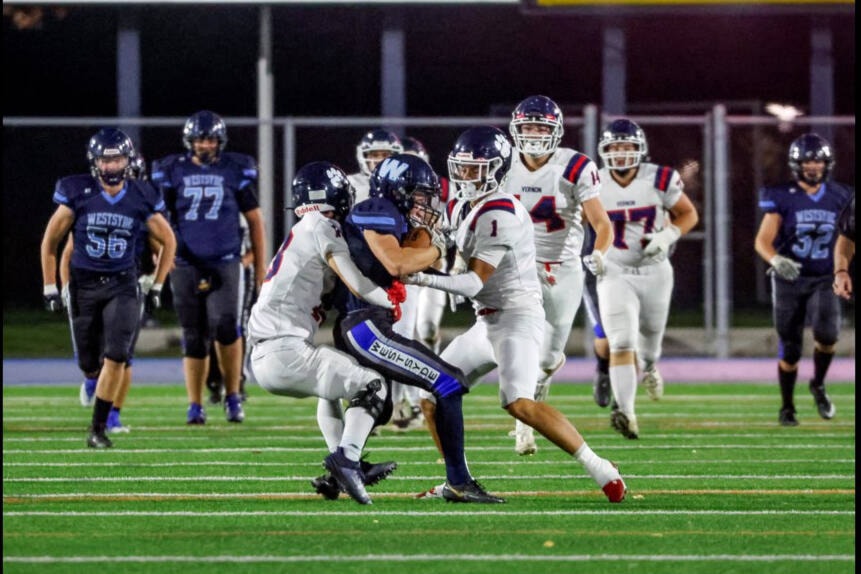 Vernon Panthers defenders Seth Holte (left) and Liam Greenan surround a Westsyde ball carrier during the Cats’ 47-15 Interior AA Senior Varsity Football Conference victory Friday, Oct. 13, at Hillside Stadium in Kamloops. (Allen Douglas/Kamloops This Week) 