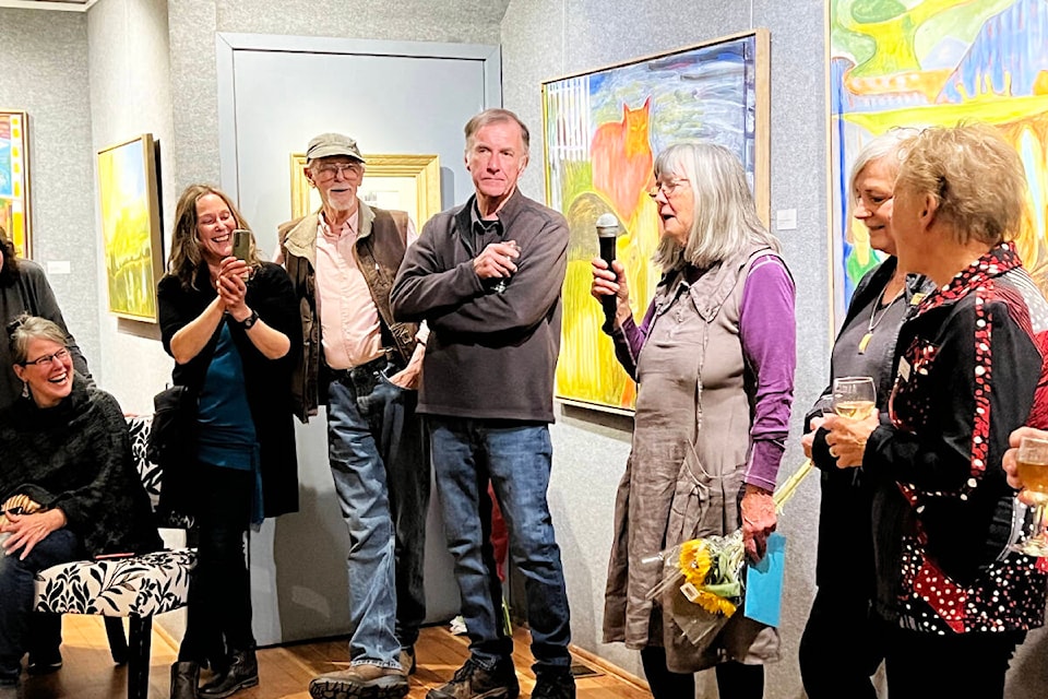 Artist Roberta Robson speaks to the crowd gathered at opening reception for the Station House Gallery’s October show. (Angie Mindus photo - Efteen) 