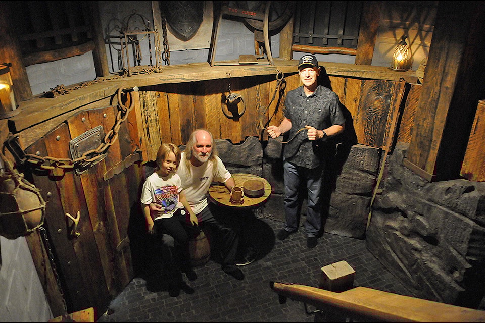 Rob Forde (right), seen here with Mark Gore and seven-year-old Jack Gore on Oct. 21, 2023, transformed the Gore family’s crawl space into a dungeon. (Jenna Hauck/ Chilliwack Progress) 