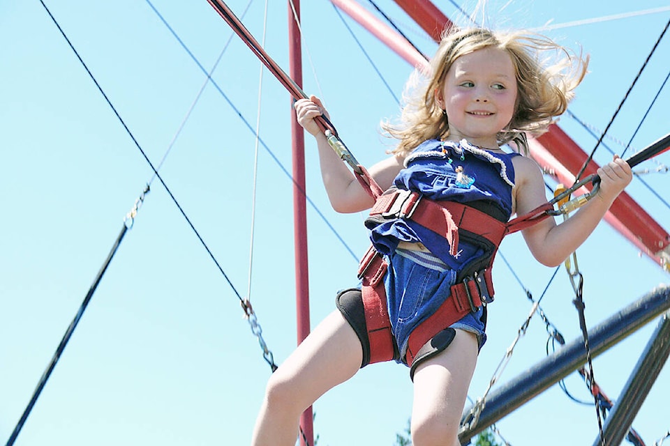 Amelia Bannister, 5, from Brookswood, got to do some high-altitude trampoline jumping at a past Aldergrove Fair Days. The event is facing cancellation in 2024 due to a lack of long-term volunteers. (91ԭ Advance Times files)  