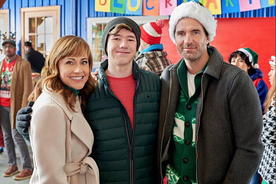 Salmon Arm’s Auldin Maxwell poses with members of his movie family, Nikki Deloach and Lucas Bryant, on the set of A World Record Christmas. (Hallmark Movies photo) 