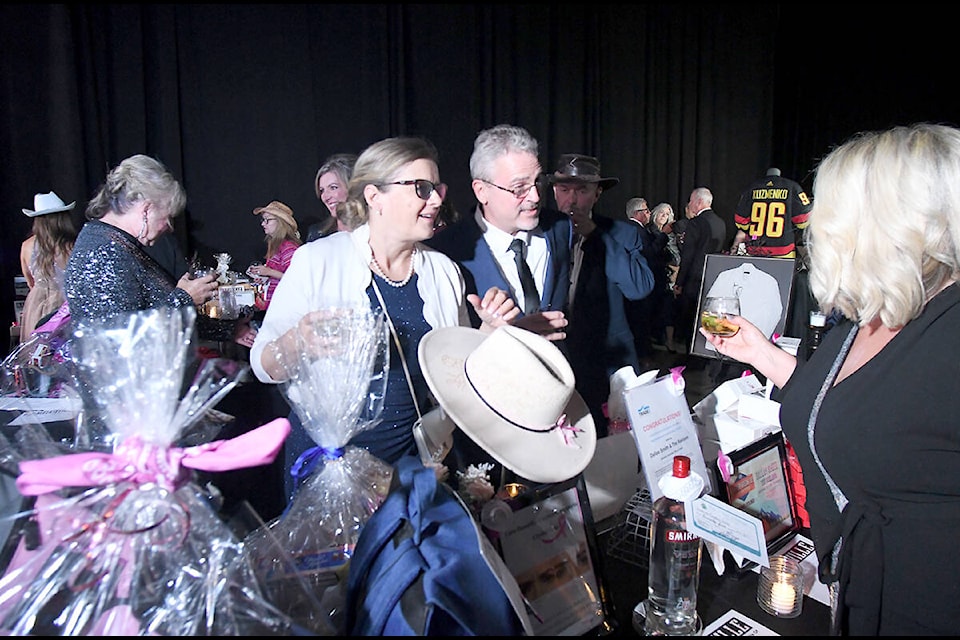 Guests at the Crystal Gala in Abbotsford mingle over the auction items. Funds raised at the annual event go toward breast cancer screening equipment at the Abbotsford Regional Hospital. (John Morrow/Abbotsford News) 