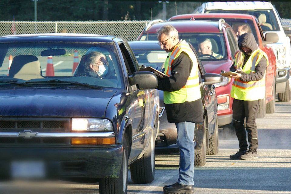 Vehicles lined up at the annual Household Hazardous Waste Plus Collection event in the parking lot of the George Preston rec centre on Saturday, Oct. 28. (Dan Ferguson/91ԭ Advance Times) 