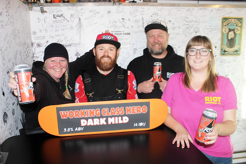 Riot Brewing Co.’s bronze award for its Working Class Hero dark mild is celebrated, from left, by: co-owner Aly Tomlin; brewer Jesse Grass; co-owner Ralf Rosenke; and manager Shay Kuhnert. (Photo by Don Bodger) 