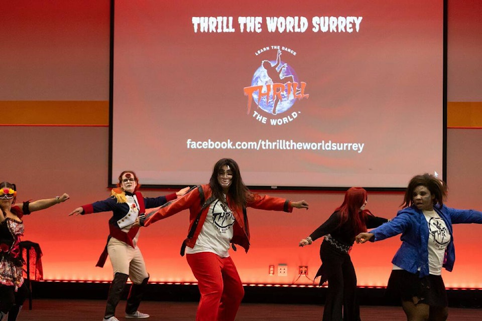 Charlotte Barlow, centre, Donna Marie Darling, Natalie Binns and other “zombies” dance to the beat of Michael Jackson’s “Thriller” during a “Thrill the World Surrey” event at KPU Surrey on Saturday afternoon, Oct. 28. It was part of a worldwide gathering to celebrate the song’s iconic video. (Photo: Anna Burns) 