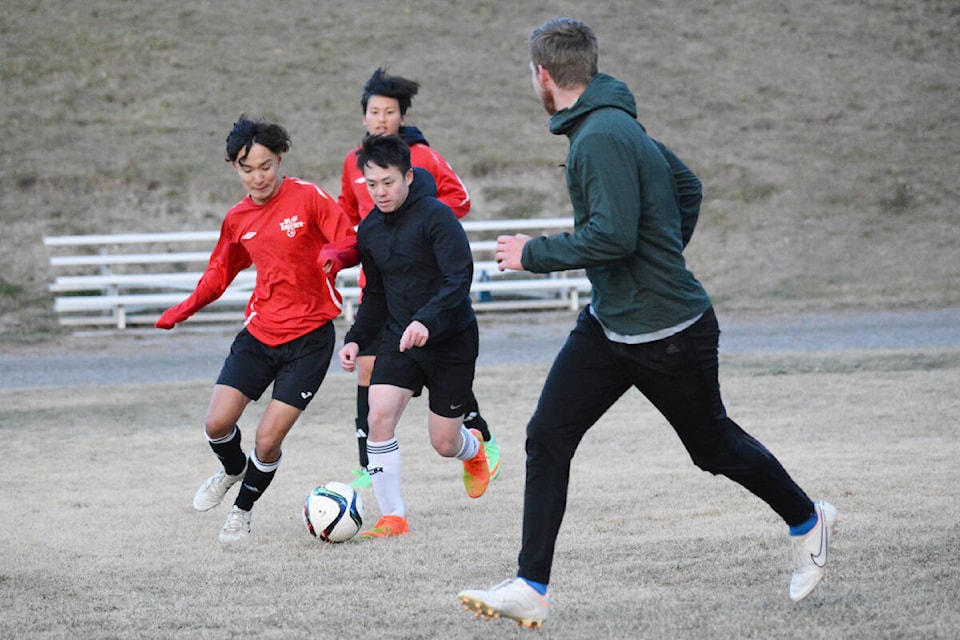 Lake City Secondary School Falcons Cham Sai Hong (right) and Mion Kinugasa fighting for the ball with Kangmin Kwon (back) and Dorian Lavoie (near) of the Williams Lake Men’s team Tuesday, Oct. 24. (Monica Lamb-Yorski photo - Efteen) 
