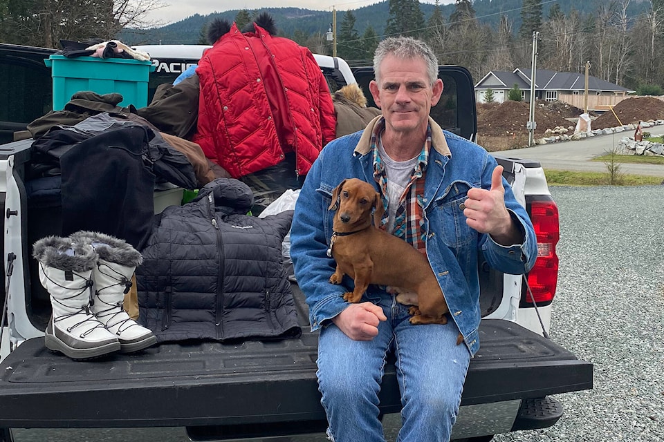 Mark Braunagel sits on the tailgate of a pickup truck full of clothing donations his sister Lynn Nelson raised in honour of Braunagel’s 50th birthday in 2020. Braunagel and Nelson were able to distribute two truckloads of clothing to Port Alberni’s vulnerable citizens. (SUBMITTED PHOTO) 