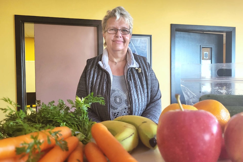  Vivian Gillard recently received a bag of mixed fruits and vegetables from Langley’s Healthy Living Bags program provided through Meals on Wheels and Langley City. The bags cost $6 a month. (Kyler Emerson/Langley Advance Times) 