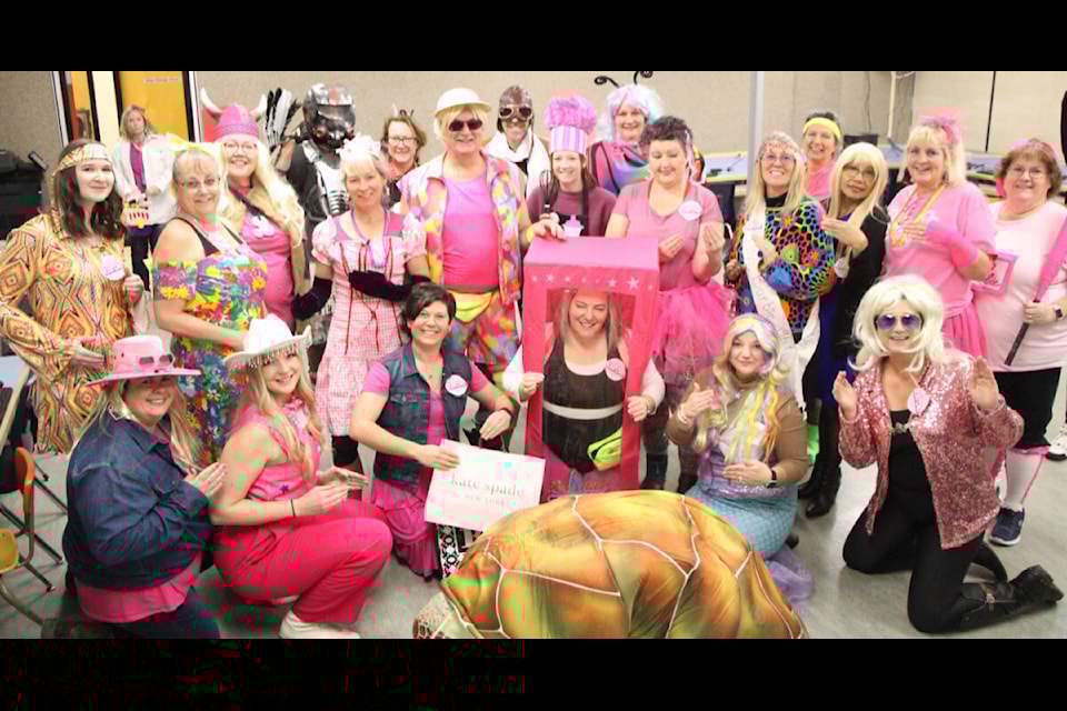 The staff of Horse Lake Elementary School were all inspired by hit-film Barbie to dress up as Barbie and Ken dolls, much to the delight of their students. (Patrick Davies photo - simplymastery) 