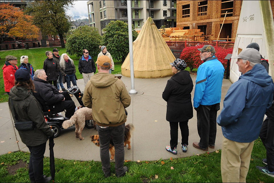 Veteran Jim Harris (in scooter) leads a group of people on a tour during the Legacy Walk around the former CFB grounds on Saturday, Nov. 4, 2023. Here they are seen at All Sappers’ Memorial Park at Keith Wilson and Vedder roads. (Jenna Hauck/ Chilliwack Progress) 