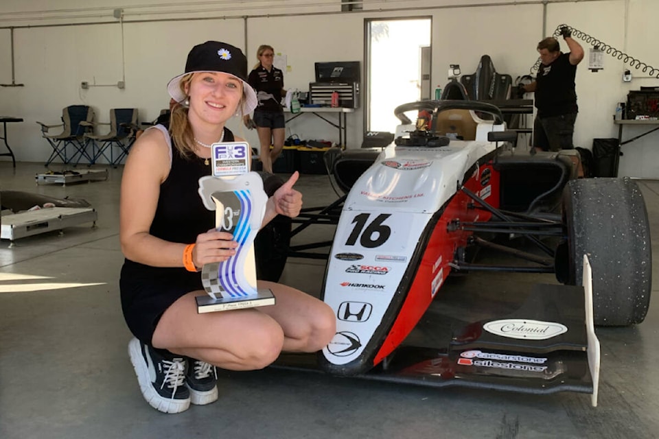 Nicole Harvda poses next to her car following a race. (Photo courtesy of Nicole Havrda) 