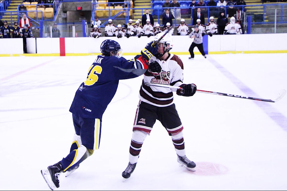 100 Mile House Wranglers Kayden Stark and Revelstoke Grizzly David Ander brawl during a game last Saturday. (Patrick Davies photo - 100 Mile Free Press) 