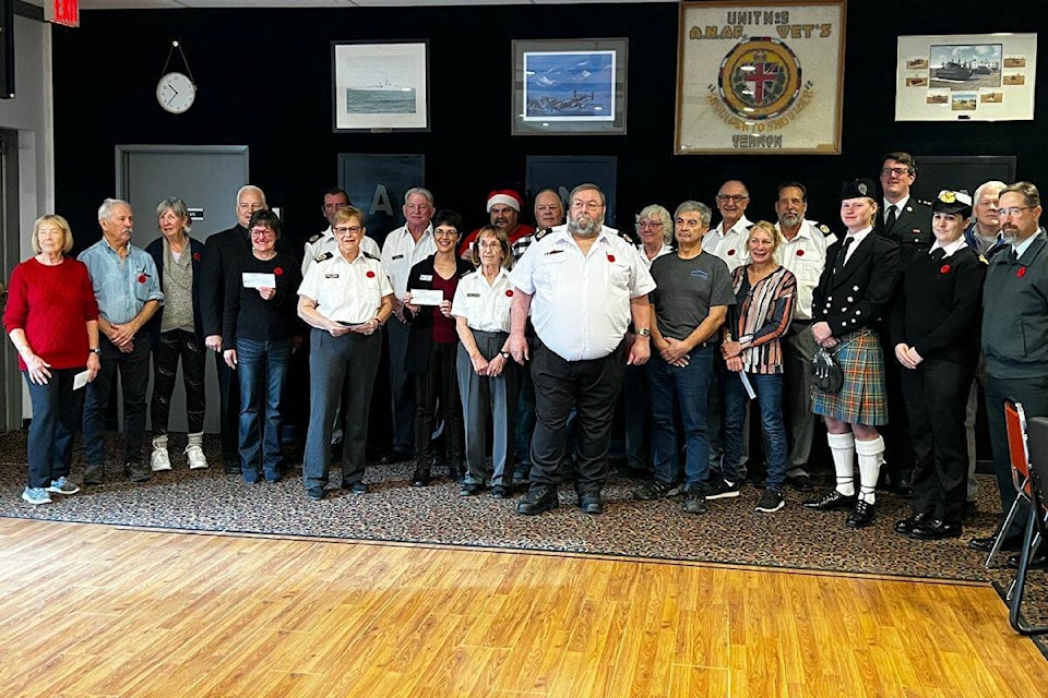 Members of the ANAF pose with the recipients of the 15 organizations that the $21,500 will go towards. (Bowen Assman- Morning Star Photo) 