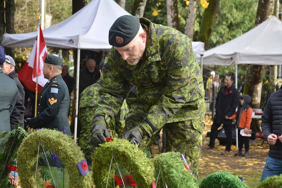 A Canadian Forces member placed his poppy on a wreath at the Fort 91ԭ cenotaph following the 2023 Remembrance Day ceremony. (Matthew Claxton/91ԭ Advance Times) 