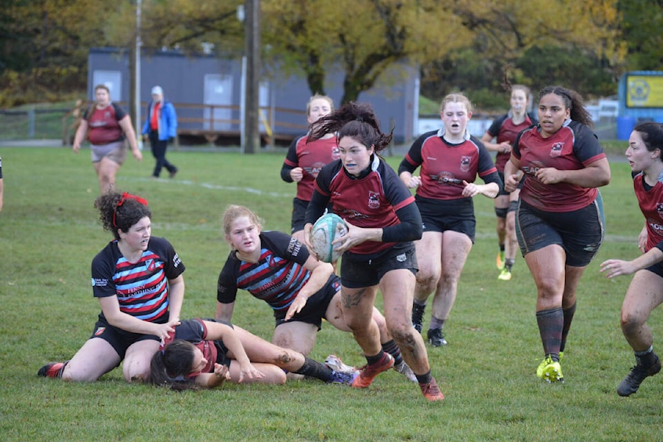 Kickers inside centre Chloe Speed running after receiving an offload in a match against the Castaway Wanderers from Victoria, Saturday, Nov. 4 in Cumberland. Photo by Taya Gagnon 