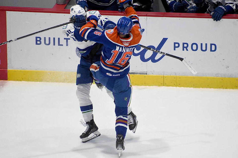 Abbotsford’s Ty Glover collides with Bakersfield’s Max Wanner in the second period on Saturday (Nov. 11). (Ben Lypka/Abbotsford News) 