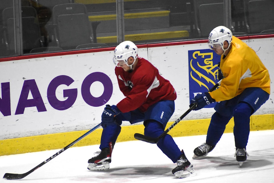 Vasily Podkolzin (red jersey) participates in a drill with Aidan McDonough on Wednesday (Nov. 8). (Ben Lypka/Abbotsford News) 