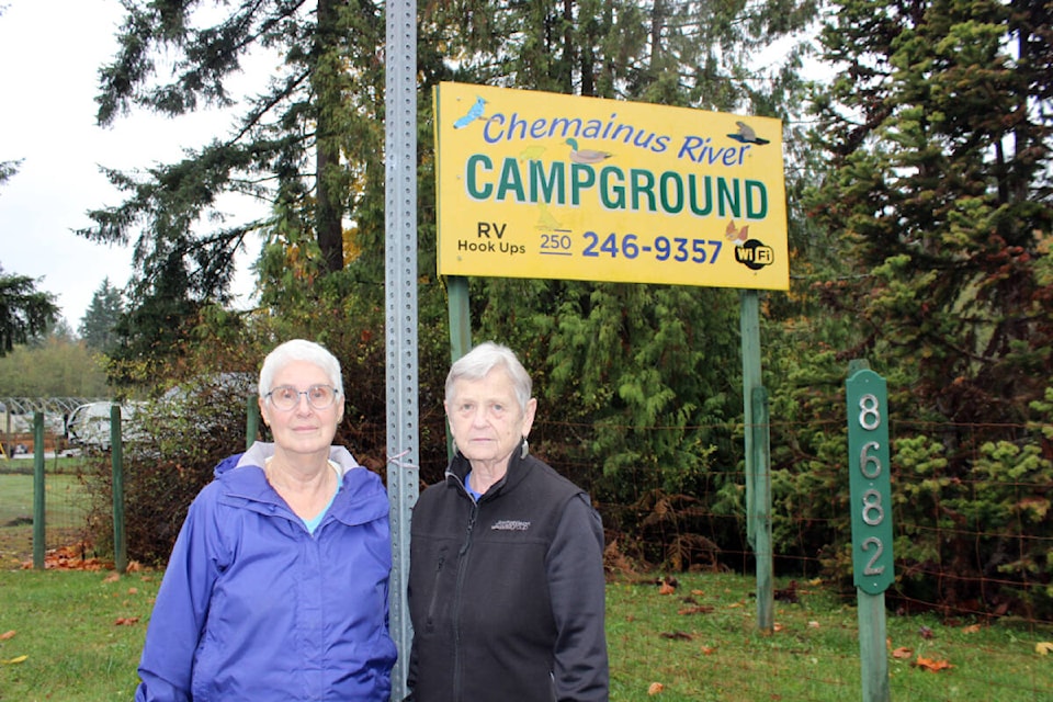 Jeri Wyatt, right, outside the entrance to the Chemainus River Campground with sister-in-law Julia Brawn. (Photo by Don Bodger) 