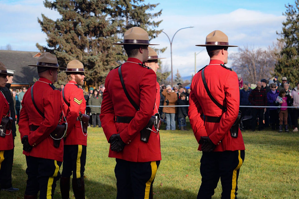 RCMP officers prepare to pause for a moment of silence at 11 a.m. (Morgan Powell/The Interior News) 