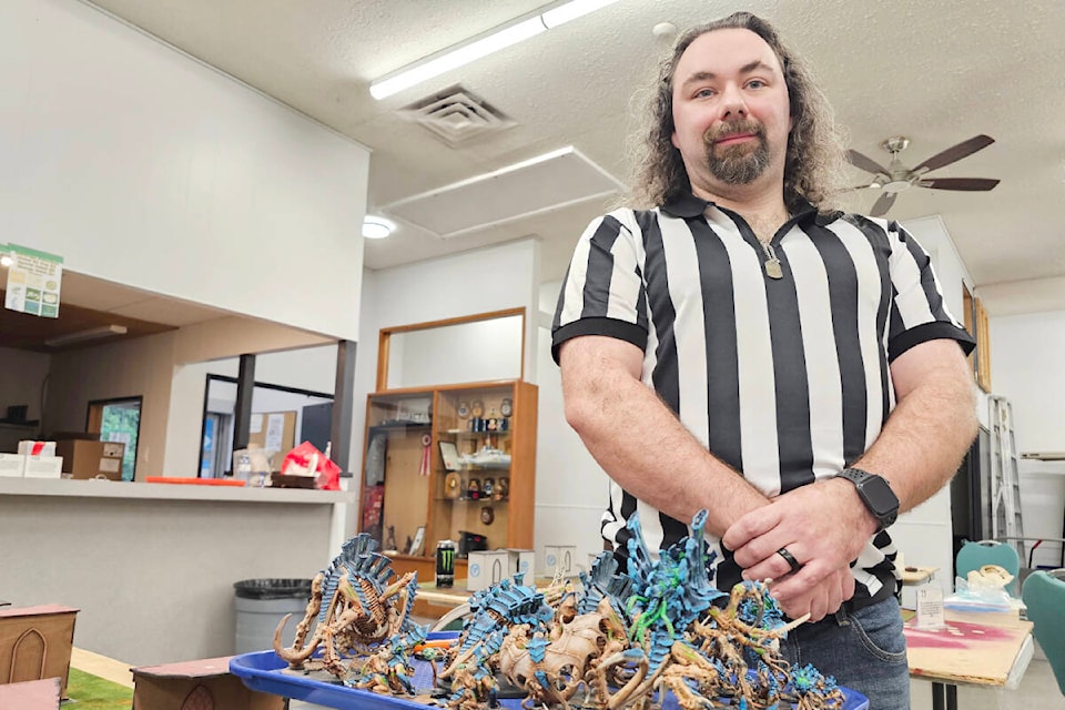 Shayne Mitchell, seen here with some Warhammer 40K miniatures, organized the ‘Heroes of the Mid Table’ tournament held over two days, Saturday and Sunday, Nov. 18 and 19, in Aldergrove at the Royal Canadian Legion’s meeting hall. (Dan Ferguson/91ԭ Advance Times) 
