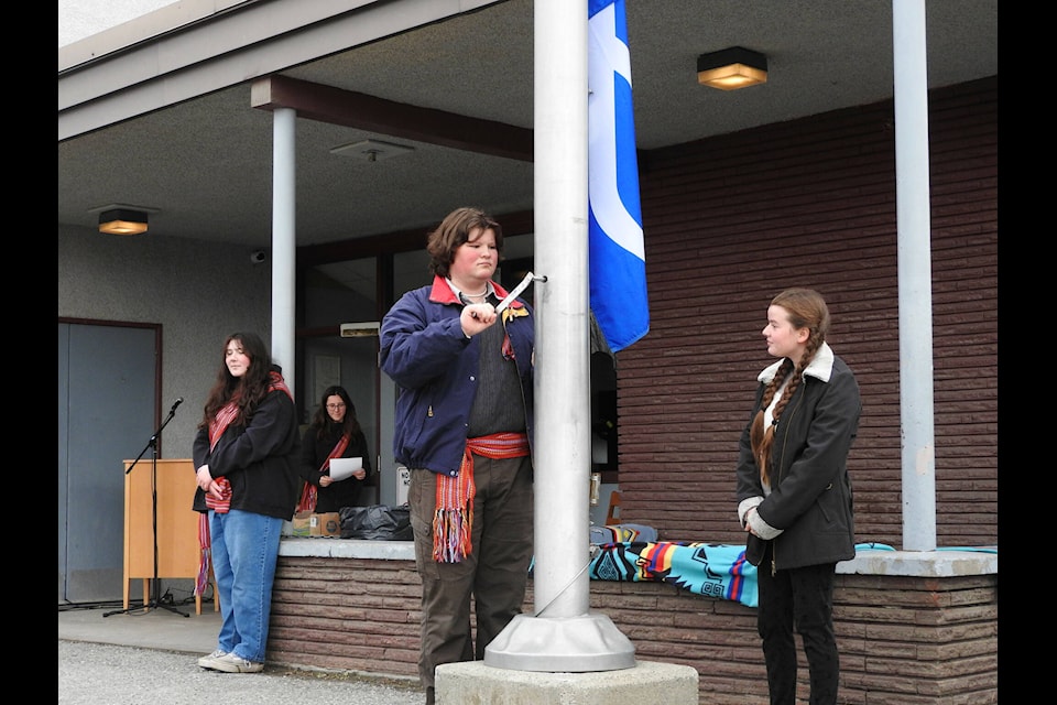 Edison Wilmot, a student at Mt. Baker Secondary School, raised the Métis flag on Louis Riel Day on Nov. 16 (Gillian Francis photo) 