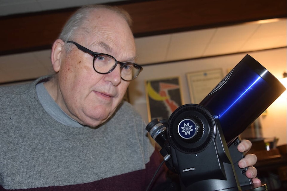 Chris Gainor looks through his Meade ETX telescope. The International Astronomy Union has named an asteroid after him called 20041 Gainor. (Brendan Mayer/News Staff) 