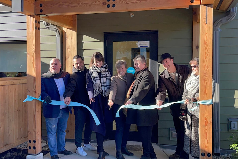 Ellen Frood, third from right, and Chris Alemany, second from right, of Sage Haven Society, are joined by community leaders to officially open Wiiksahiqu?il, Sage Haven’s new second stage housing complex. (SUSAN QUINN/ Alberni Valley News) 