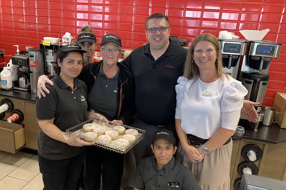 From May 1-7, Tim Hortons Smile Cookie Campaign supported charities in communities across Canada, including the Comox Valley Healthcare Foundation – one of 600 Canadian charities and community groups supported through the campaign. During that week, owners of the local Tim Hortons, the Toijonen/Poon Family and the Kandola family selected the Comox Valley Healthcare Foundation as the recipient with local proceeds from every Smile Cookie sale being donated to enhance healthcare in our community. The campaign raised $12,485 for the CVHF. Funds will be used to ensure residents of the Comox Valley and surrounding communities receive the best possible care right here at home. For more information about the Comox Valley Healthcare Foundation, visit cvhealthcarefoundation.com Pictured: Staff and management at the Tim Hortons on Anderton Road pose for a photo with Comox Valley Healthcare Foundation director of partnerships and collaboration Rhonda Stevens (in white). Photo supplied 
