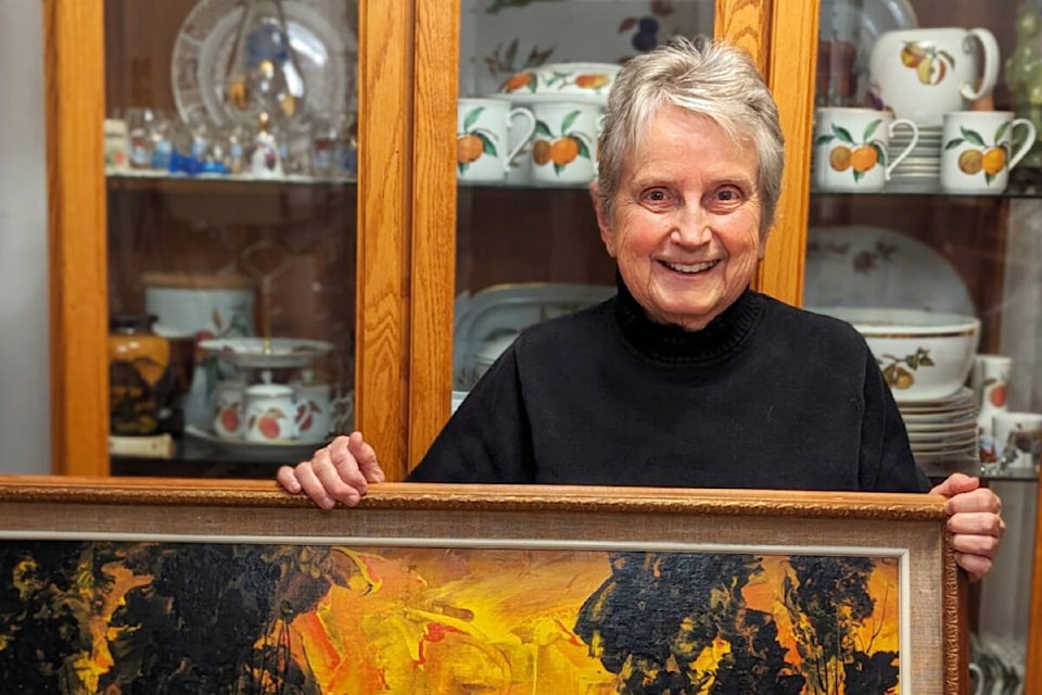 Maidie Hilmo holds “Sunny Landscape” by Carle Hessay, which will be available to view at 91ԭ Community Music School on Saturday, Nov. 25. (Special to 91ԭ Advance Times) 