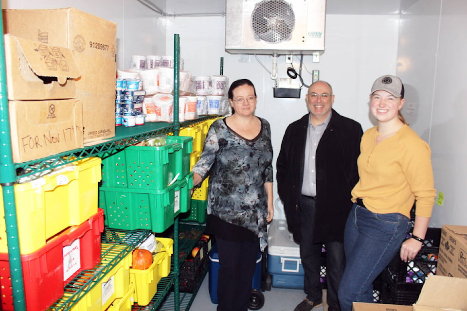 Emily Holmes, Jason Farrugia and Daisy Hiebert inside the spacious new cooler at the Chemainus Harvest House Food Bank. (Photo by Don Bodger) 