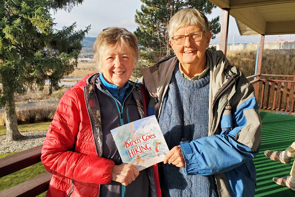 Katie Hayhurst, left, and Chris Czajkowski hold up newly-published children’s book Chris wrote in the early 1980s for Katie’s son Birch Kuch. (Monica Lamb-Yorski photo - Williams Lake Tribune) 