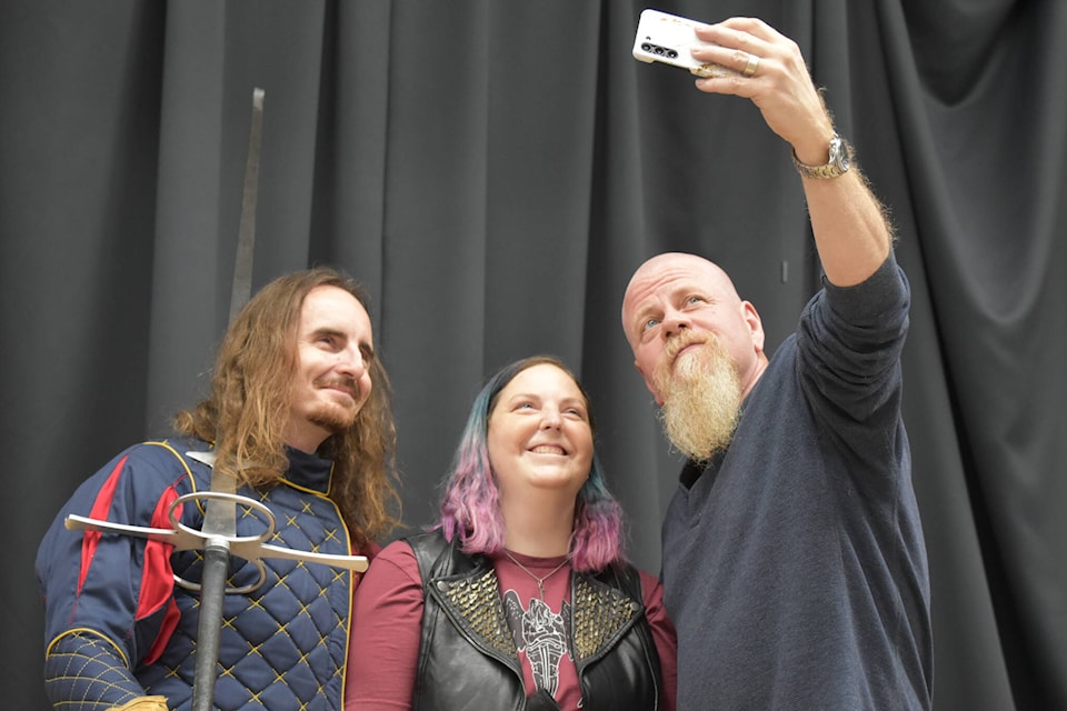 Actor Michael Cudlitz takes a photo with some fans at the 2023 Kelowna ComiCon, which took place at the Rutland Centennial Hall. (Jordy Cunningham/Capital News) 