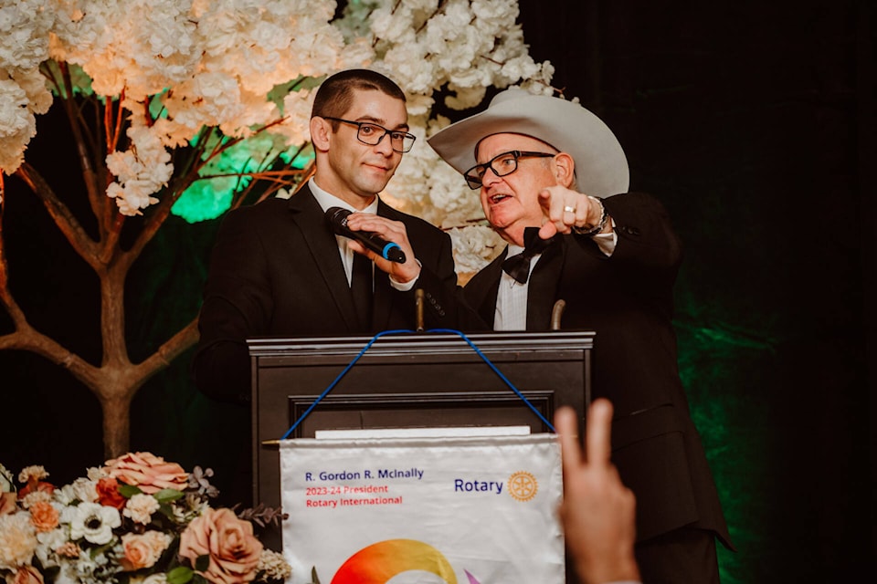 Brody and Don Raffan call the shots during the Kalamalka Rotary Dream Auction Nov. 18. (Contributed) 