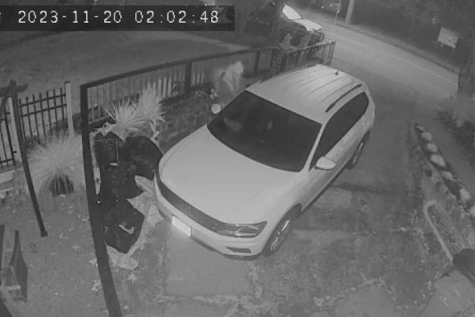 Screenshot of the security camera footage posted on Facebook of someone trying Matt Savard’s car door handles. (Courtesy of Facebook) 