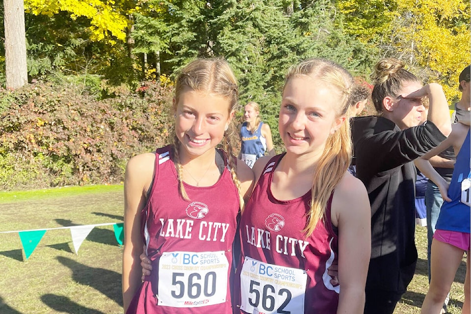 Lake City Secondary School athletes Ella Thiessen (left) and Nadia Wallin are all smiles before the junior girls cross-country race at provincials in Surrey held Saturday, Nov. 4. (Chloe Menard photo) 