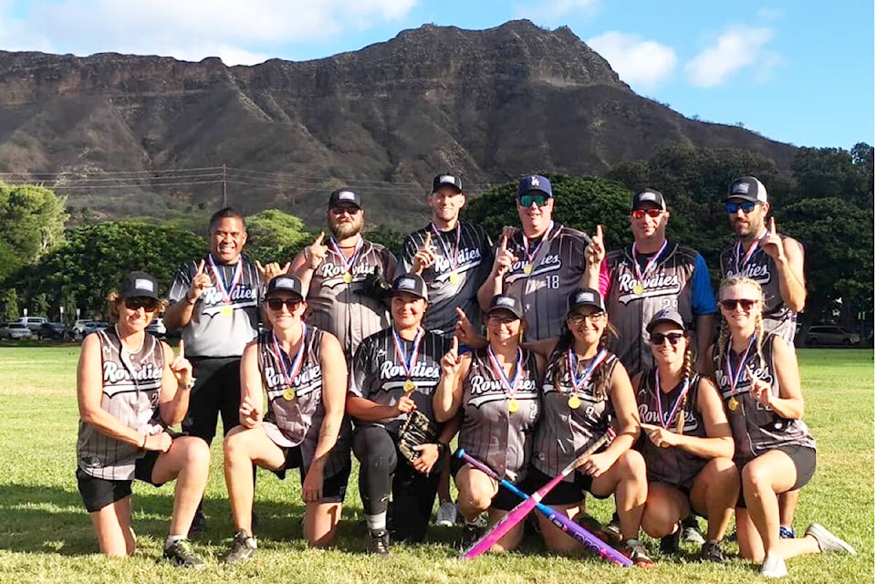 Rowdies members pictured above are: Kyle Guigui, back from left, Derek Rogers, Nick Wente, Darren Sanford, Nick Surette and Andre Carrier. Linda Barbondy-Rich, front from left, Tierney Maytchuak, Brandy Lee, Karen Yaworski, Lesley Allgrove, Alena Mayer and Janet Thompson with the Diamond Head volcano in the background at a tournament in Hawaii. (Photo submitted) 