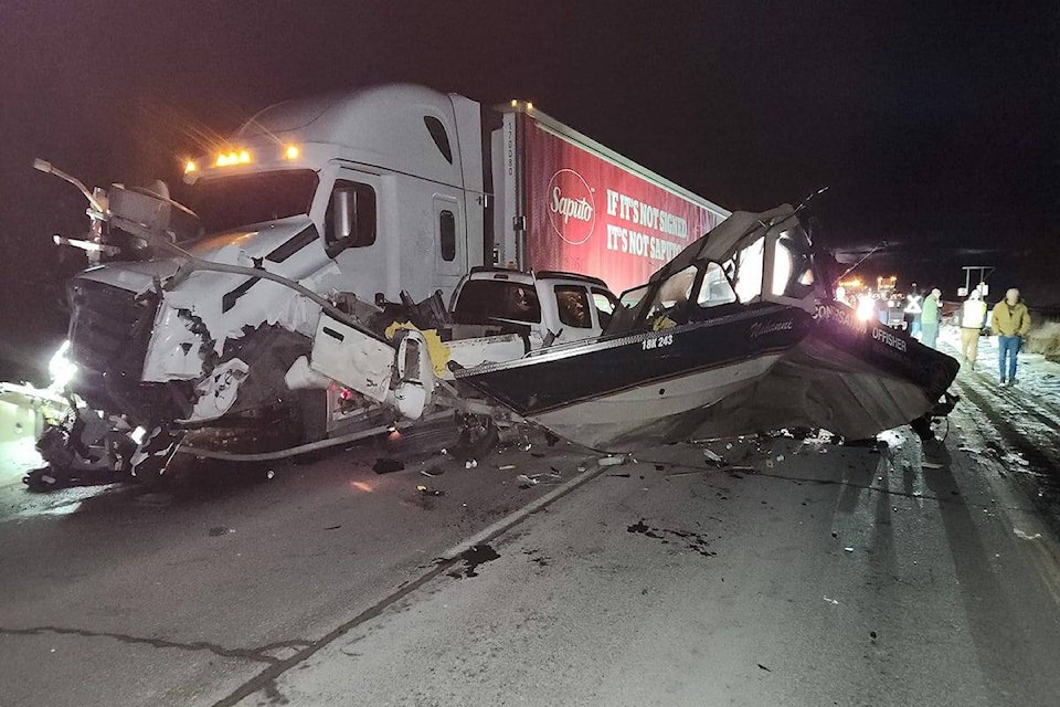 A crash between a semi-truck and a pick-up truck pulling a boat occurred on Tuesday night on the Okanagan Connector. (Stefani Chies/Facebook) 