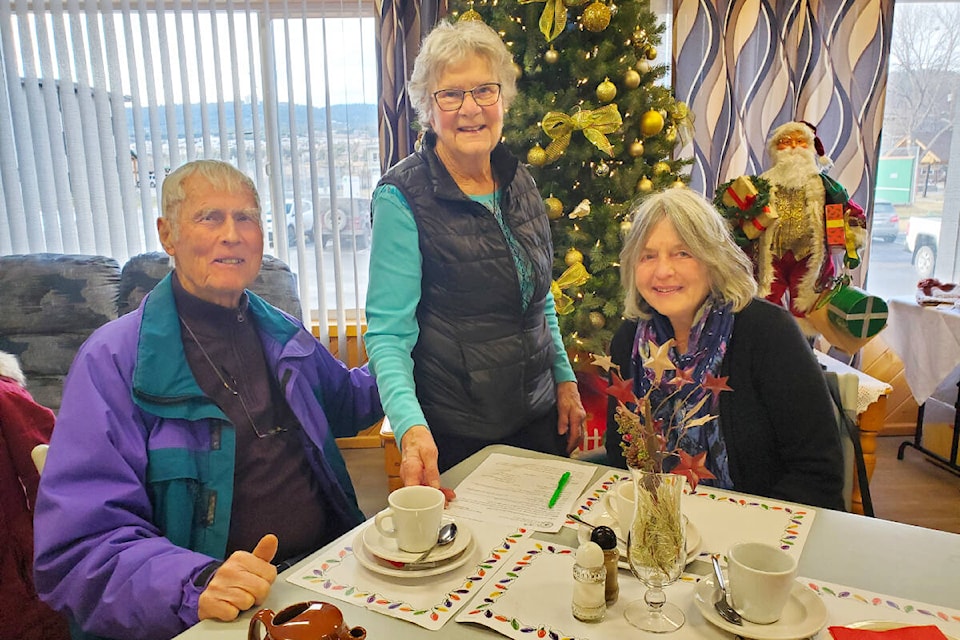 Long-time Museum of the Cariboo Chilcotin volunteer Pam Mahon, centre, George Atamanenko, left, and Bonnie Atamanenko during the museum team Sunday, Dec. 3. (Monica Lamb-Yorski photo - Efteen) 