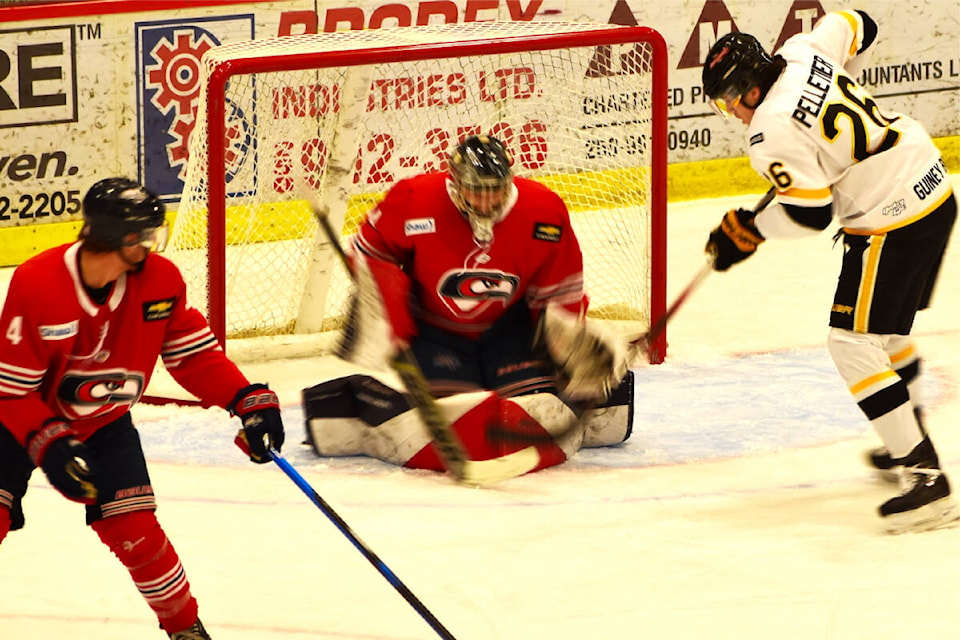 Victoria Grizzlies player Luc Pelletier scores one of his two goals on Cowichan Valley Capitals goalie Emerik Despatie, while defender Jonathan Lanza can’t reach that far. (Frank Peebles photo - Quesnel Cariboo Observer) 