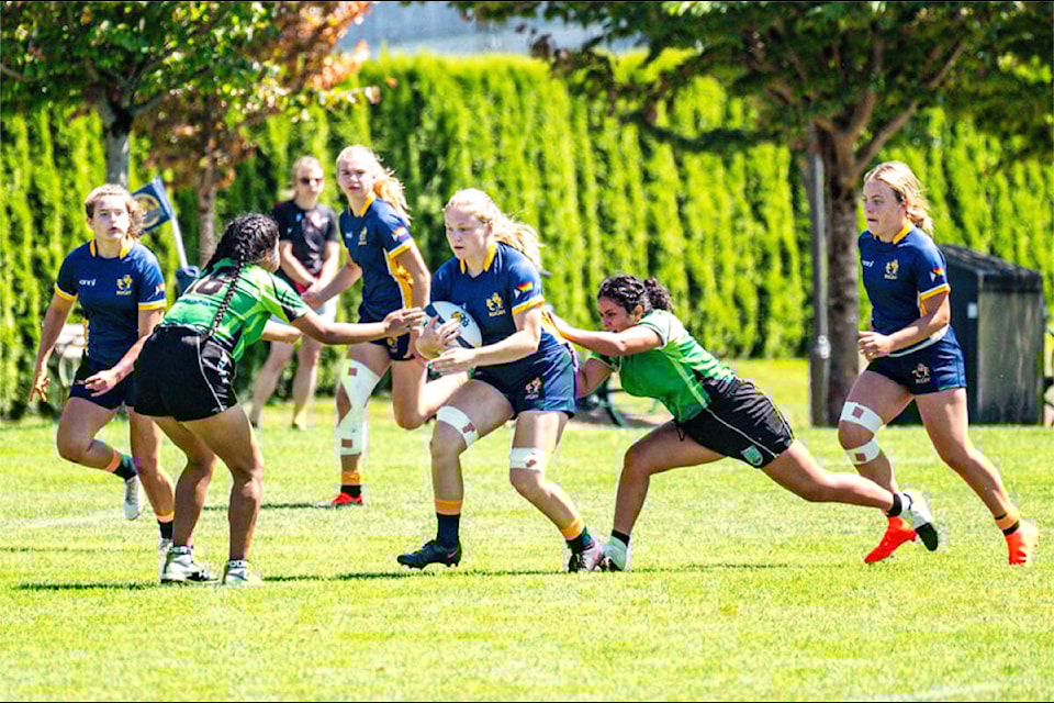 Gabrielle Knox, of Williams Lake, with the ball centre, competes with the BC Bears U18 Girls 7s at the 2023 Western Canadian Championships held at the Calgary Rugby Club in Calgary, Alta. (Rick MacDonald/BC Rugby photo) 