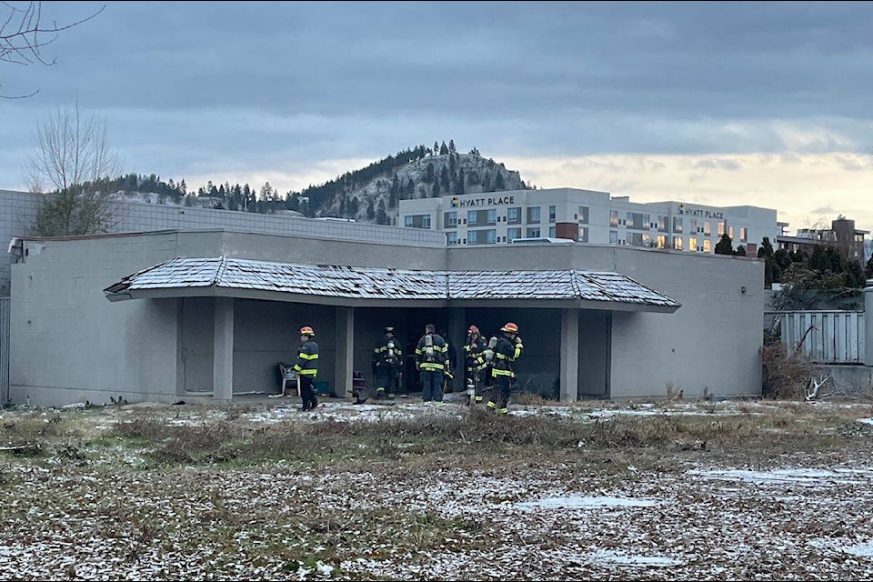 Smoke and flame could be seen from an abandoned commercial building in Kelowna on Friday, Dec. 1. (Gary Barnes/Capital News) 